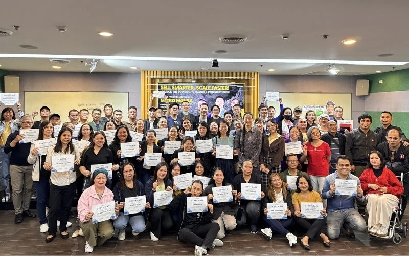 A group of TWC members holding certificates after a live training in Metro Manila